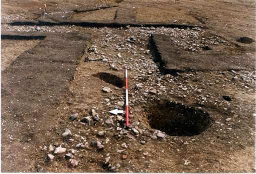Roman 'dark soil' seals the cobbled surfaces.