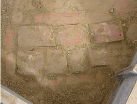 Grave capped with tiles
