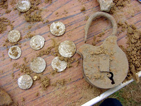 Early coins and padlock