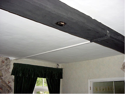 Nailed on tie-rod stabilises failing walls